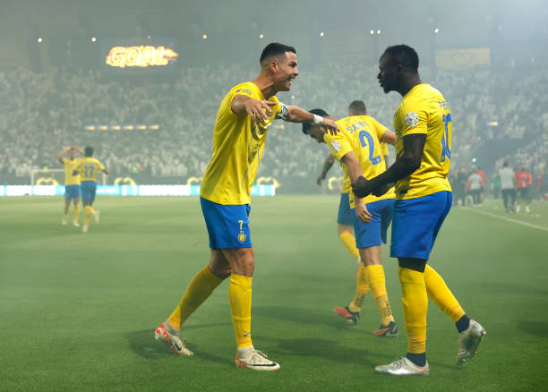 Christiano Ronaldo (right) opens the arms to Sadio Mane